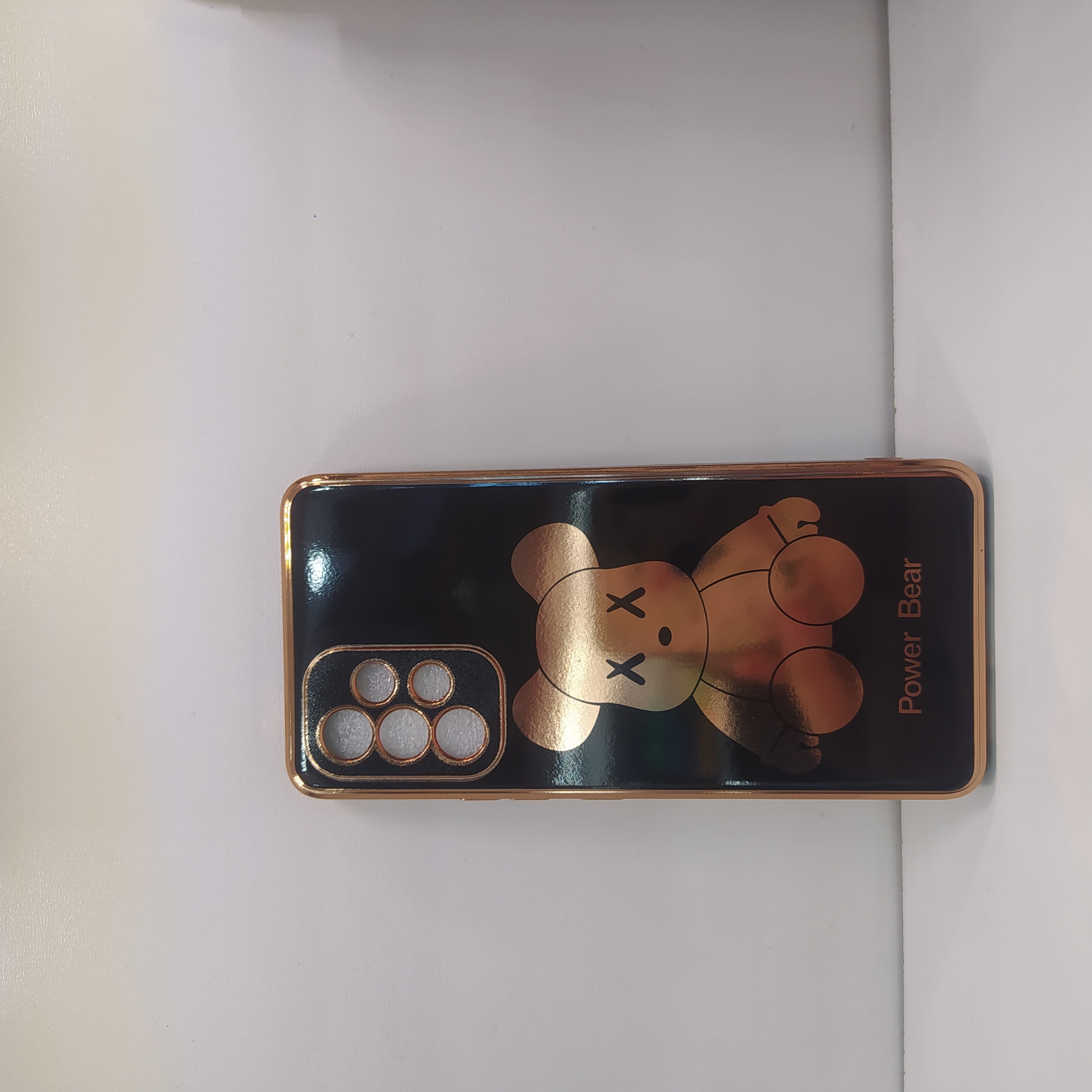 قاب گوشیSamsung A53 5G طرح مای کیس دورطلایی خرسی محافظ لنزدارمشکی